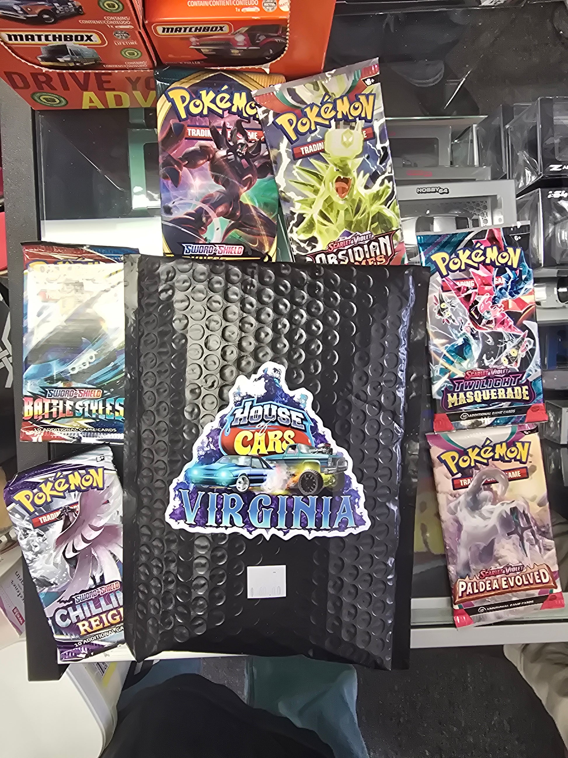 House of Cars Virginia Pokémon variety of sealed booster packs. (Scarl ...